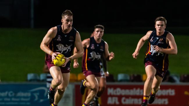 Cairns City Lions Players charge upfield in Saturdays AFL Cairns Preliminary decider at Cazalys Stadium. Picture: Emily Barker.