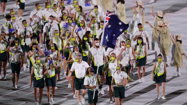 TOKYO, JAPAN - JULY 23: Flag bearers Cate Campbell and Patty Mills of Team Australia lead their team in during the Opening Ceremony of the Tokyo 2020 Olympic Games at Olympic Stadium on July 23, 2021 in Tokyo, Japan. (Photo by Patrick Smith/Getty Images)