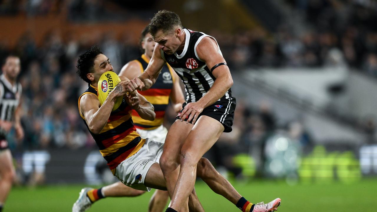 ADELAIDE, AUSTRALIA - AUGUST 17: Izak Rankine of the Crows is knocked out by a late hit from Dan Houston of the Power during the round 23 AFL match between Port Adelaide Power and Adelaide Crows at Adelaide Oval, on August 17, 2024, in Adelaide, Australia. (Photo by Mark Brake/Getty Images via AFL Photos)