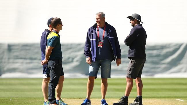 Officials are seen speaking with the curator as play is abandoned due to an unsafe pitch prior to the start of day two of the Sheffield Shield match between Victoria and Western Australia. (Photo by Mike Owen/Getty Images)