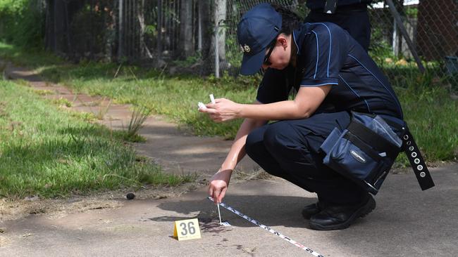 Police investigate blood on the footpath near where an alleged police shooting of a young Aboriginal man happen in Palmerston suburb of Gray. Picture: (A)manda Parkinson