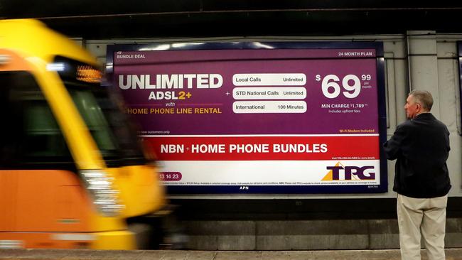 Business. TPG takeover of iiNet. A TPG Billboard at Wynyard Station.