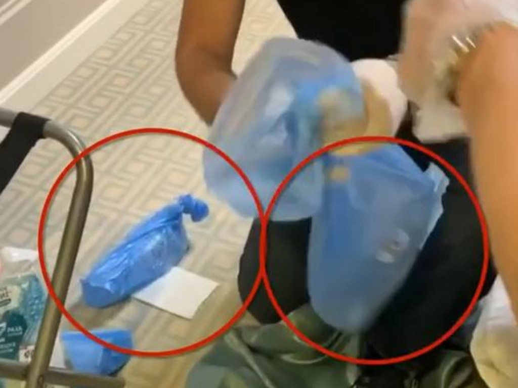 Mr Navalny’s team, wearing protective gloves, collect and place the water bottles into blue plastic bags. Picture: Instagram.