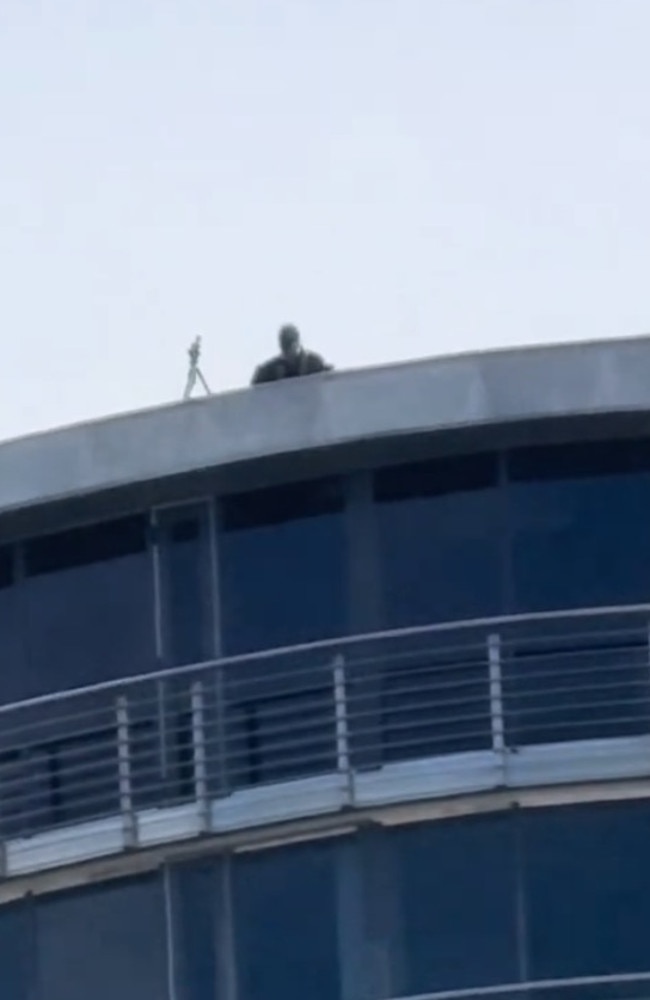 One local captured a video of police snipers perched on the roof of the Opera House and a nearby business building.