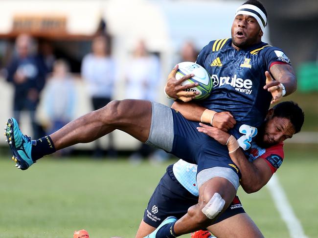 Rona picks up and slams Highlanders beast Tevita Nabura in a trial match ahead of the Super season.