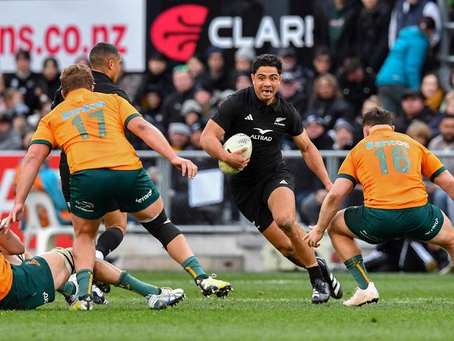 New Zealand's Anton Lienert-Brown (C) runs with the ball. Picture: Sanka Vidanagama / AFP.