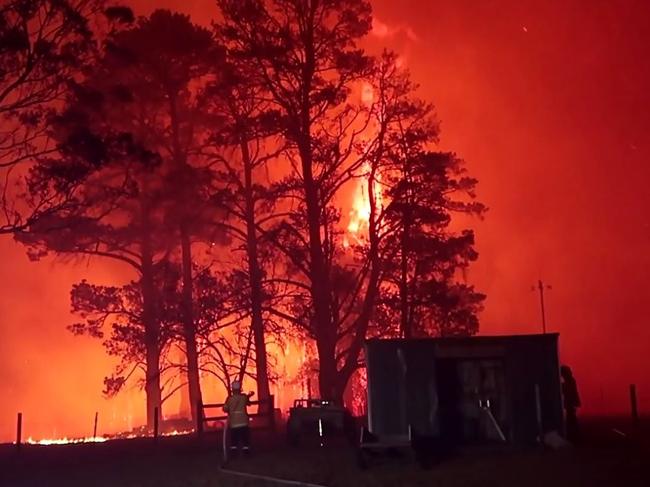 Vision compliments of FIRE & RESCUE NSW who were doing fire protection on Braddocks Rd, Orangeville when a number of properties came under ember attack and crown fires across tree tops. Picture: FIRE and RESCUE NSW