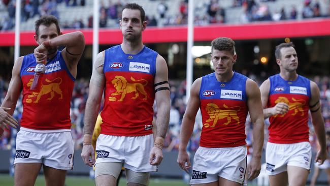 Lions players leave the field after their most recent MCG game. Picture: AAP Image/Daniel Pockett