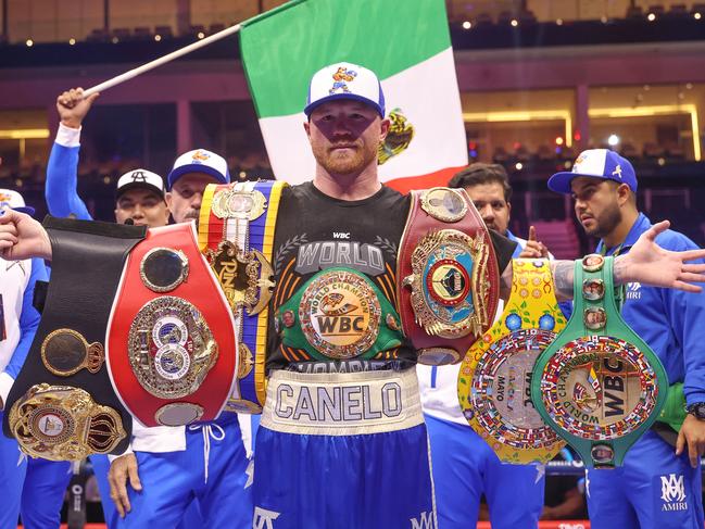 Canelo poses with all the belts at super-middleweight. Picture: Richard Pelham/Getty Images