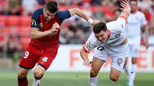 Adelaide United’s Tomi Juric takes on Melbourne City’s Curtis Good during the teams’ A-League clash at Coopers Stadium. Picture: Getty Images