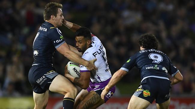 Michael Morgan attempts to wrap up Melbourne’s Josh Addo-Car. Picture: Ian Hitchcock/Getty Images