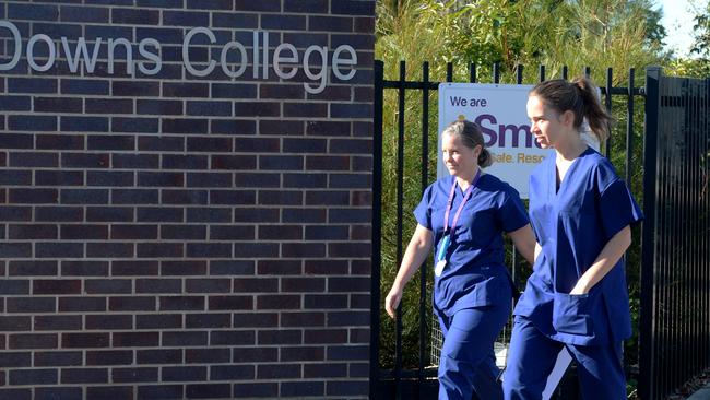 Medical staff arrive at Keilor Downs College this morning after students returned positive COVID-19 tests. Picture: Andrew Henshaw