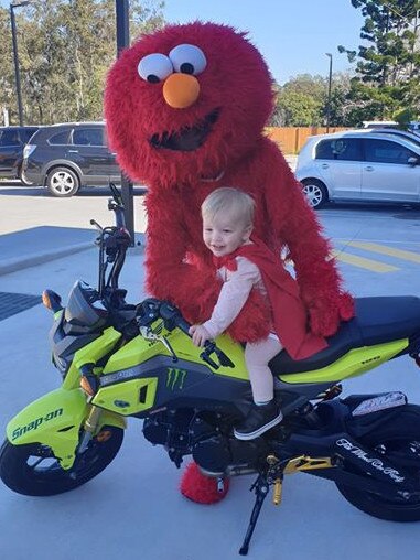 Andy Parsons in an Elmo costume rode his motorbike to his son Theo’s kindy for Book Week. Quest Community News Book Week Photos. Springfield News.