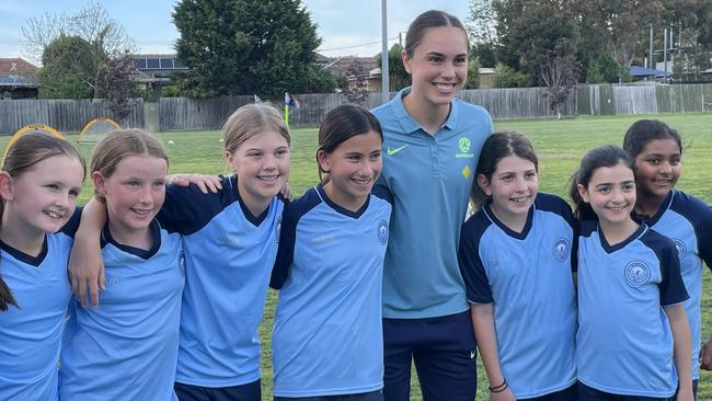 Matilda footballer Emma Checker pictured with Glen Eira junior footballers at the FIFA Women’s World Cup Volunteer Programme launch event.