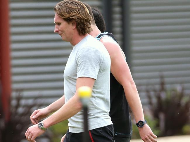 James Hird leaves the field after running laps on Monday morning. Picture: Hamish Blair