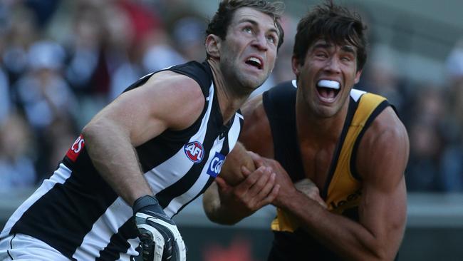 Travis Cloke battles with Alex Rance in 2013.