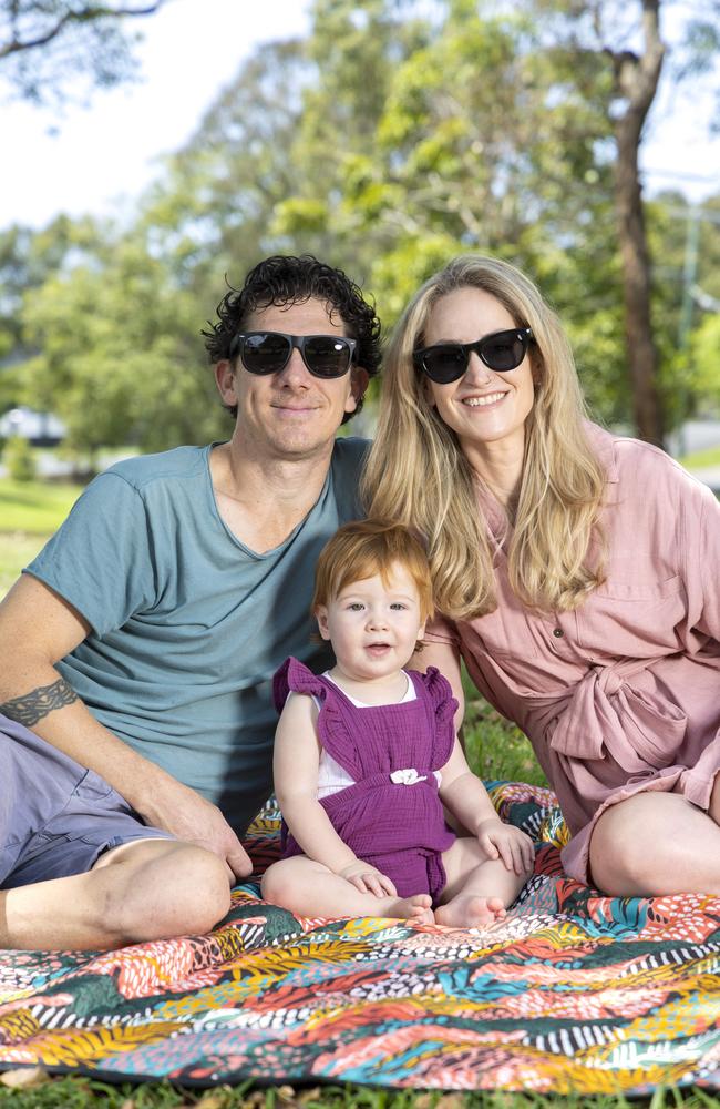 Michael Kiernan wears regular sunglasses while Renee Martin tries on a pair of Meta’s Ray-Bans. Pictured with their one-year-old, Imogen. Picture: Richard Walker