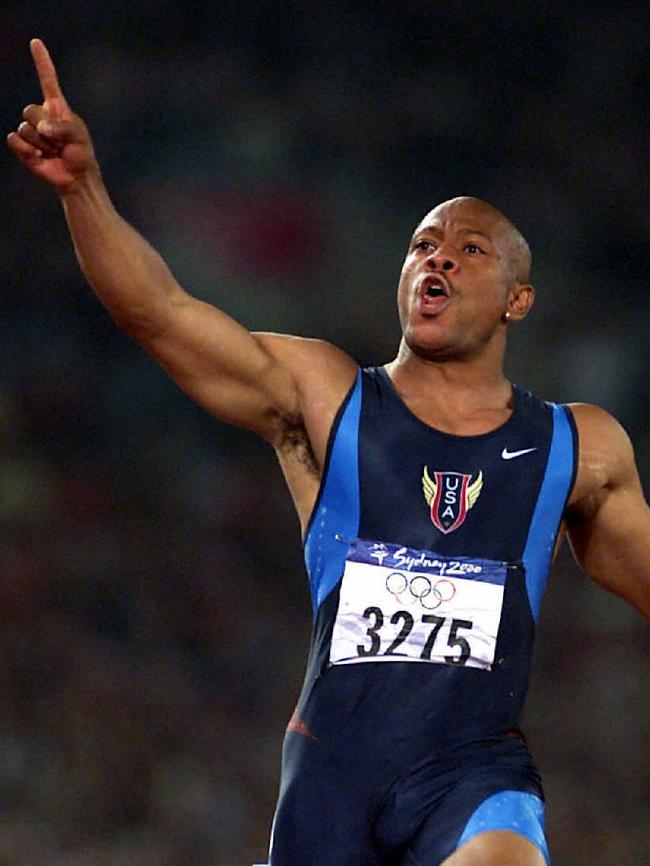 His finest hour as a starting official was firing the pistol for the men's 100m final at the Sydney Olympics. Pictured is Maurice Greene crossing the finishing line after the athletes, much to Mr Martin’s relief, got away cleanly. Picture: Phil Hillyard.