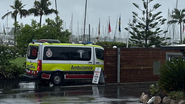 An ambulance waits at the Manly marina after a man disappeared after jumping into the water. Picture: Samantha Scott