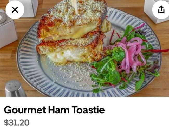 The snap of the $31.20 ham toastie, which was overflowing with cheese, from a Perth cafe on a delivery service platform was shared to Reddit. Picture: Reddit/@Affectionate_Run_672