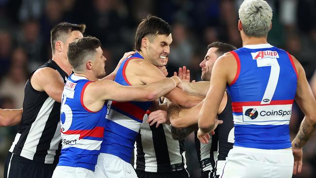 MELBOURNE, AUSTRALIA - MAY 31: Magpies players remonstrate with Sam Darcy of the Bulldogs  during the round 12 AFL match between Collingwood Magpies and Western Bulldogs at Marvel Stadium, on May 31, 2024, in Melbourne, Australia. (Photo by Quinn Rooney/Getty Images)