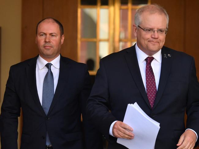 Treasurer Josh Frydenberg and Prime Minister Scott Morrison arrive at a press conference in Canberra, Thursday, April 23, 2020. (AAP Image/Mick Tsikas) NO ARCHIVING