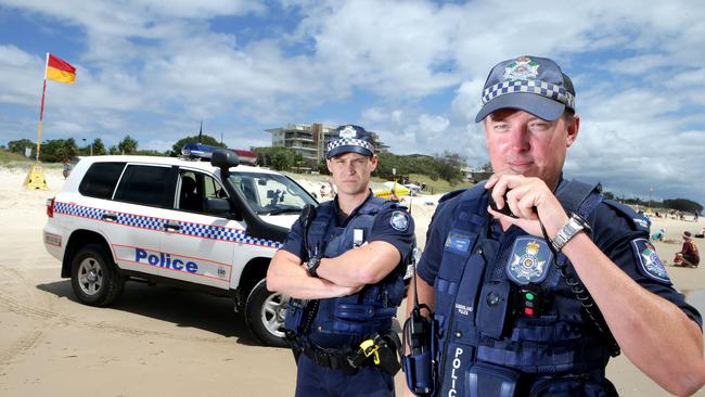 Pictured are police officers Con Ben Keatch (L) and Con Robbie Paul on Woorim beach, Bribie Island. Photo by Chris McCormack.