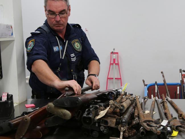 An officer takes stock, lock and barrels. Picture: NSW Police Media