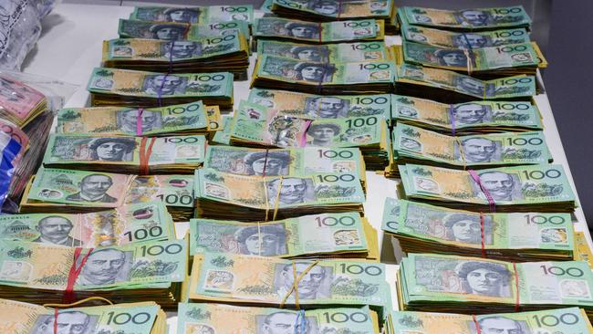 Crime doesn’t pay – SA Police display $1.8 million in cash seized during Operation Ironside. Picture: NCA NewsWire / Brenton Edwards