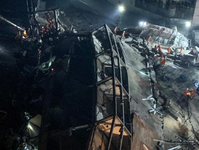 Rescuers search for survivors in the rubble of the collapsed Xinjia Hotel in Quanzhou, China. Picture: AFP