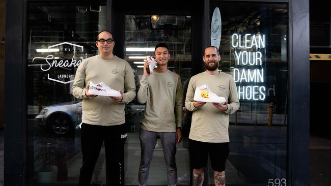 Mr Cheng and his business partners at the Melbourne store.