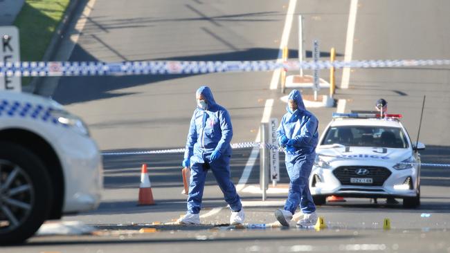 Crime scene … Forensic police on sealed-off Chester Rd. Picture: Tim Hunter