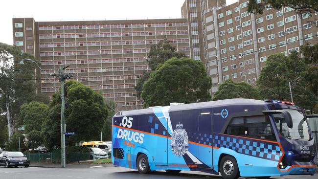 A police booze bus outside the public housing buildings in Flemington. Picture: David Crosling