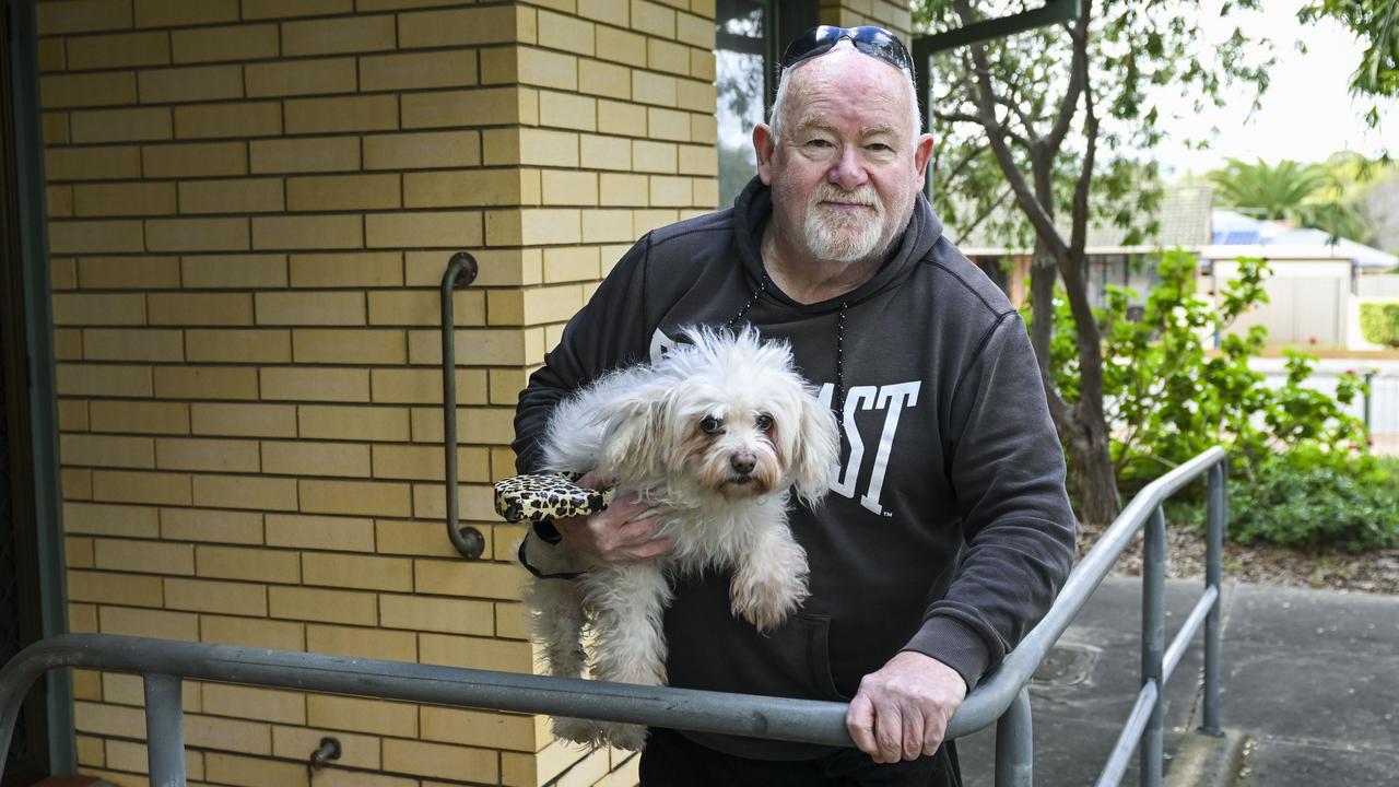 Housing Trust resident John Levins 66, and his dog Bindi at his Morphett Vale unit. Thursday. Picture Mark Brake