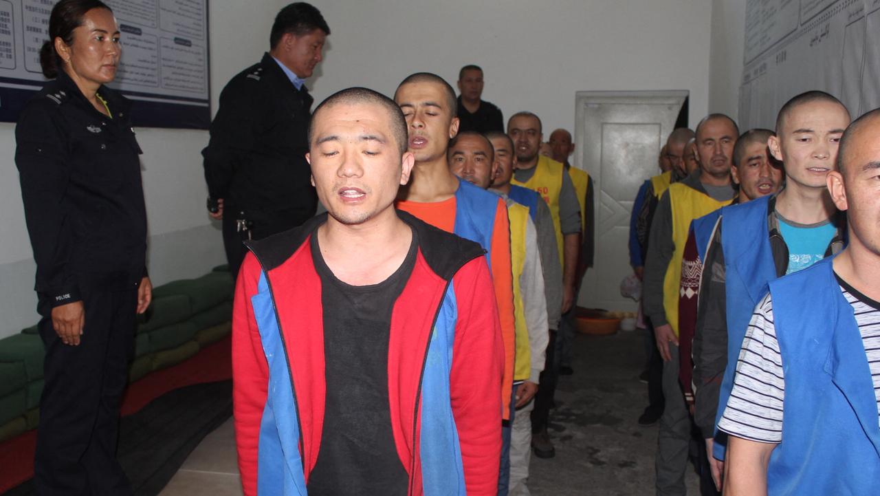 This undated image released by the Victims of Communism Memorial Foundation on May 24, 2022, shows detainees guarded by police. Picture: AFP / The Victims of Communism Memorial Foundation