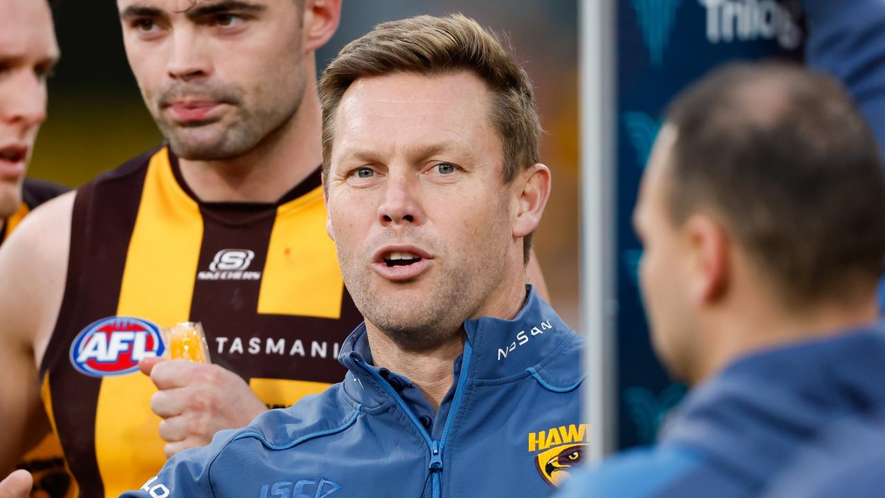 MELBOURNE, AUSTRALIA - AUGUST 20: Sam Mitchell, Senior Coach of the Hawks addresses his players during the 2023 AFL Round 23 match between the Melbourne Demons and the Hawthorn Hawks at Melbourne Cricket Ground on August 20, 2023 in Melbourne, Australia. (Photo by Dylan Burns/AFL Photos via Getty Images)