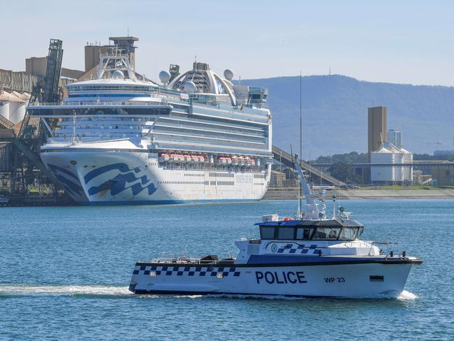 Water police patrol the Ruby Princess as it berths in Port Kembla. Picture: Simon Bullard