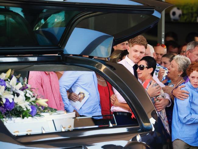 Julie Dixson surrounded by family at the funeral of daughter Jade, at Buderim on the Sunshine Coast.