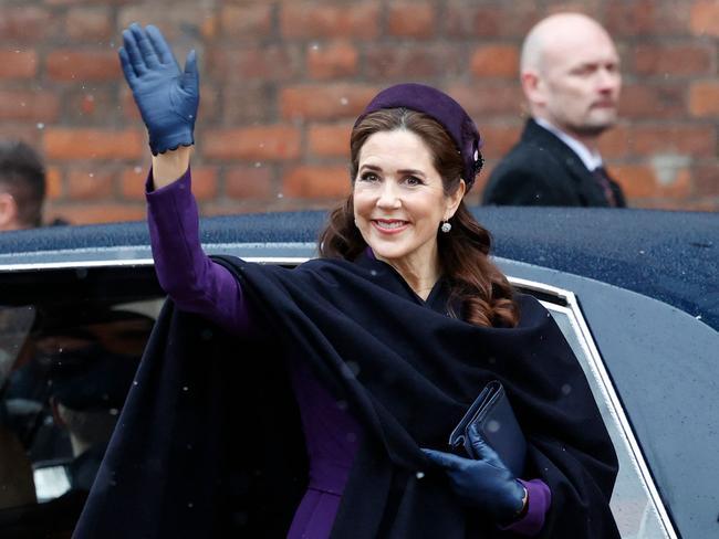 Queen Mary of Denmark waves as she arrives for a church service on the occasion of the change of throne in Denmark, in front of Aarhus Cathedral, Aarhus, Denmark on January 21, 2024. Its the first public appearance in Jutland by Denmark's new King and Queen since the change of throne one week ago. (Photo by Mikkel Berg Pedersen / Ritzau Scanpix / AFP) / Denmark OUT