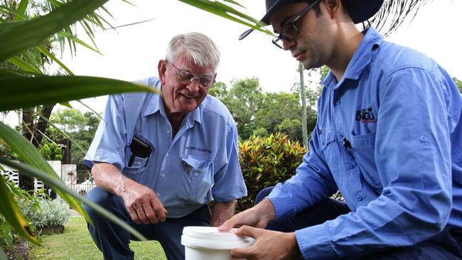 Ron Crew and Eliminate Dengue member Fred Muzzi with a “mosquito rearing container”.