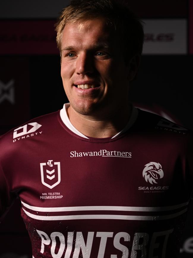 Jake Trbojevic shows off the new Manly logo.