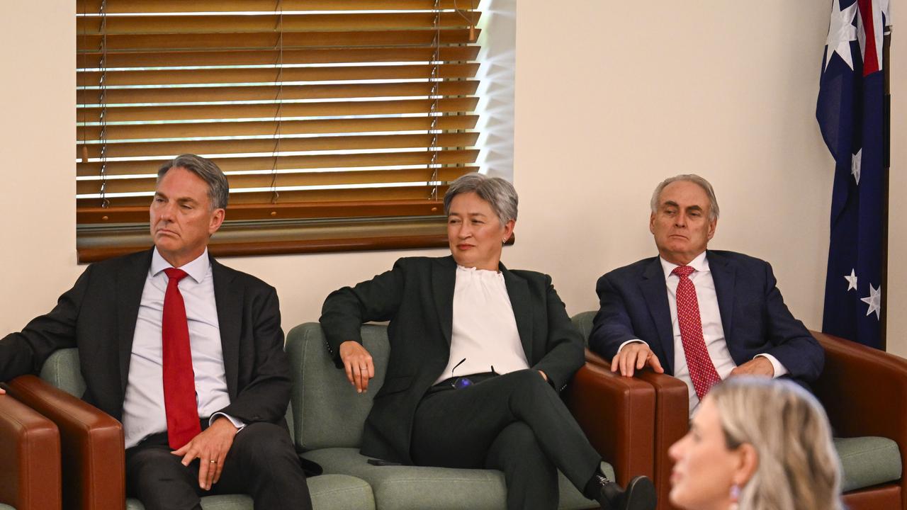Richard Marles (left), Penny Wong (middle) and Don Farrell (right) have all retained their portfolios. Picture: NewsWire / Martin Ollman