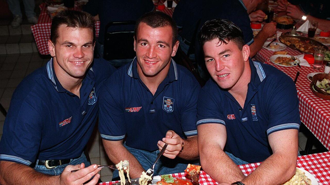 Paul Harragon, Jim Serdaris and Mark Carroll smile during an awkward team dinner during NSW Blues Origin camp in 1995.