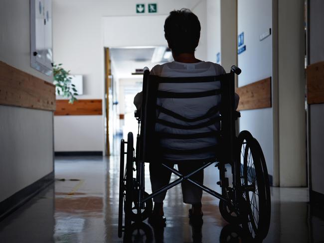 BAD AGED CARE:   Rearview shot of a senior woman sitting in a wheelchair