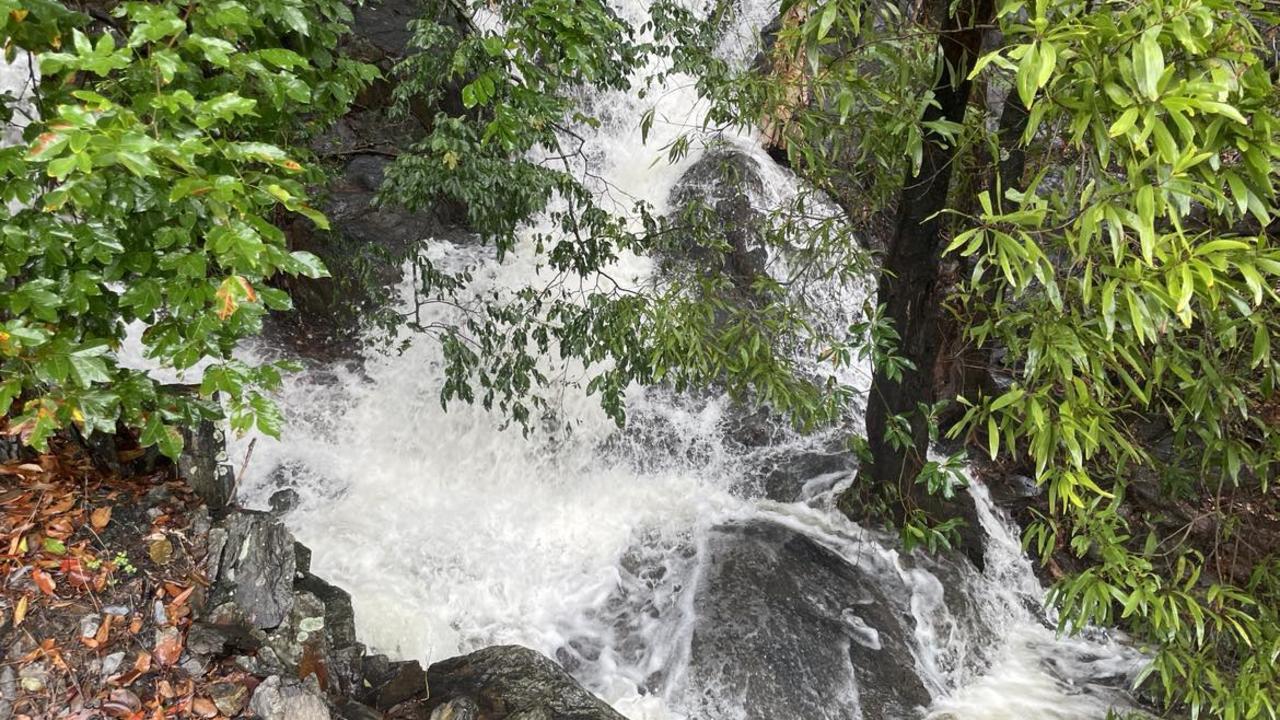 Water gushes down on to the Captain Cook Highway north of Ellis Beach on Friday December 15, 2023.