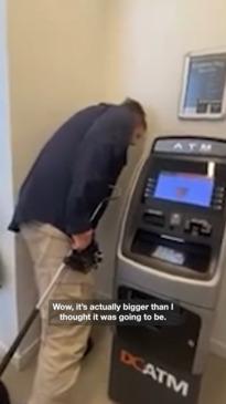 Red belly black snake found behind Queensland ATM