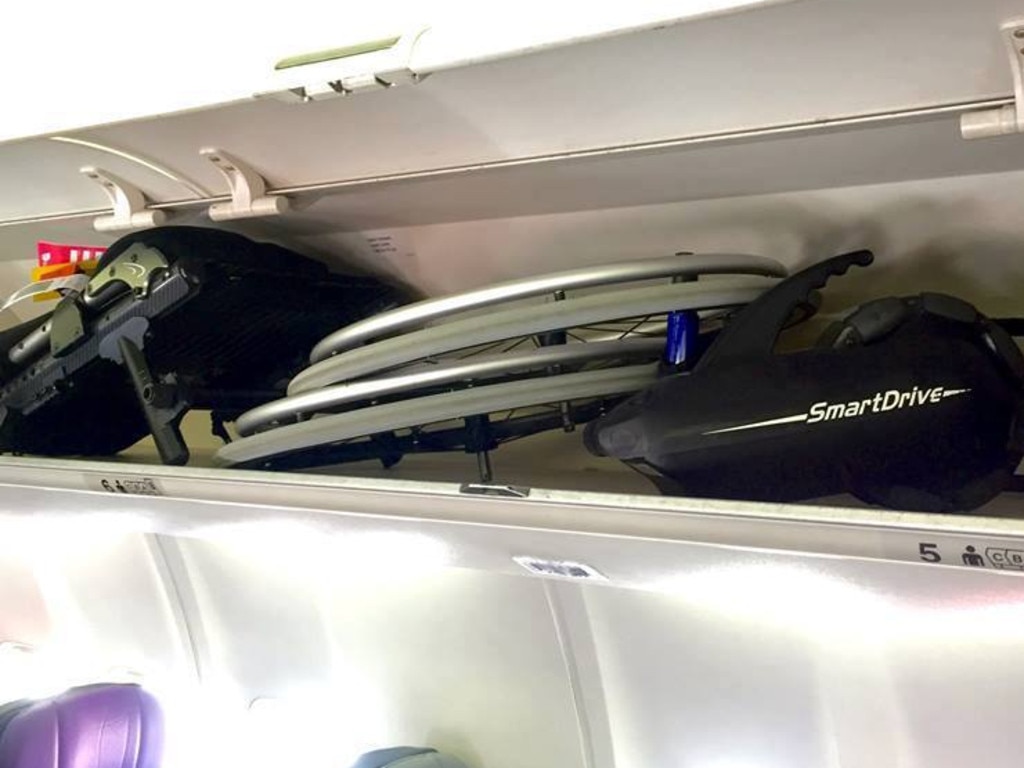 This file image shows how the wheelchair can be folded and held in the overhead compartment.