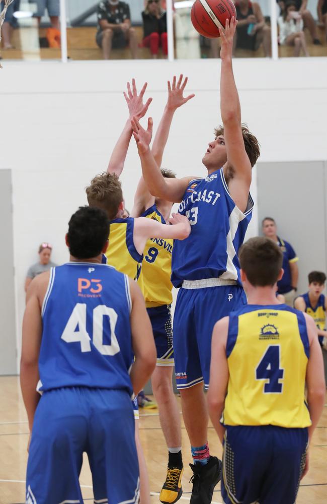 Basketball Queensland Under-16 Boys State Championships at the Coomera Indoor Sports Centre. Gold Coast Rollers (blue) v Townsville Heat Division 1 game. Rollers player Nikos Karathanasopoulos (23) and Heat’s Jack Abbott (8). Picture Glenn Hampson