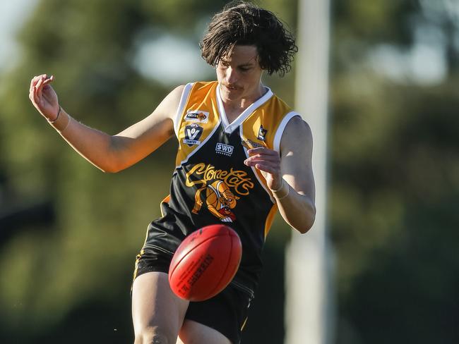 Roan Steele takes a kick for Frankston YCW.