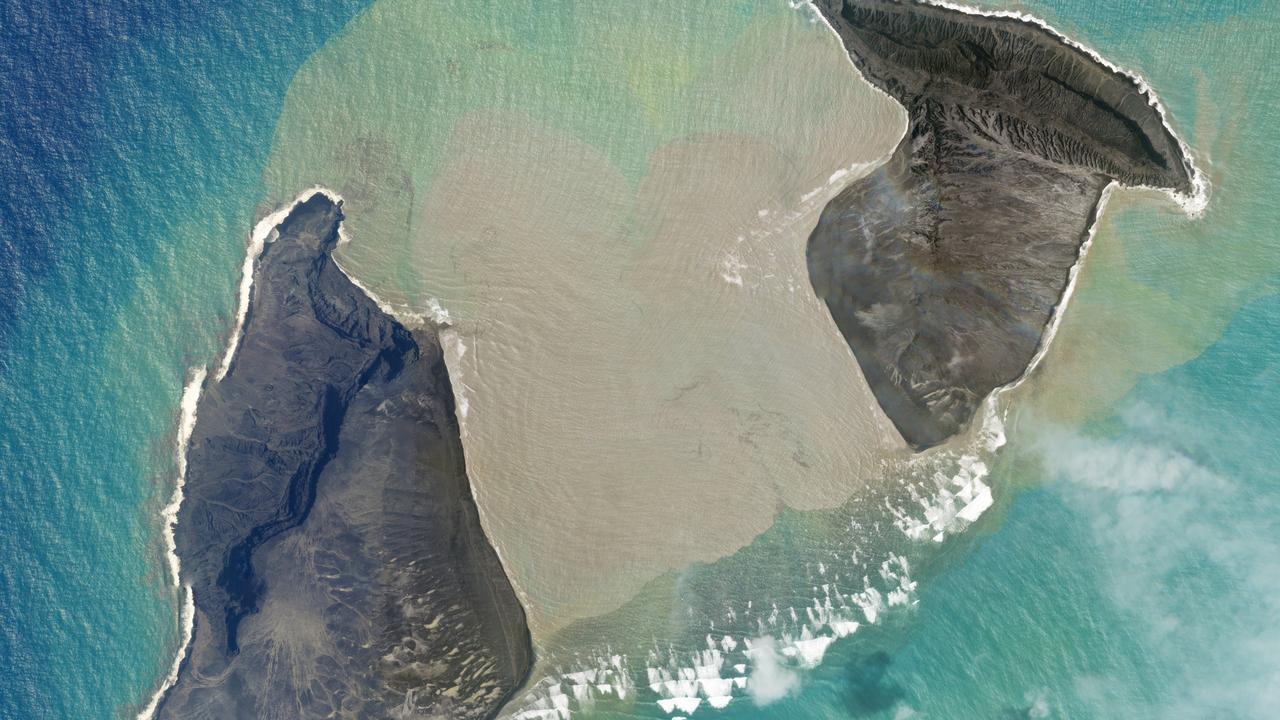 An aerial image shows the centre of the volcanic island vanish, splitting it in two.